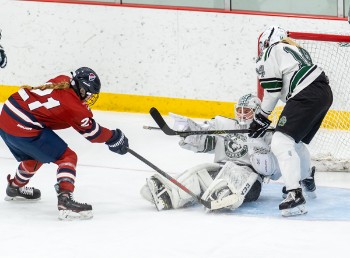 New Hampton freshman G Avery Callison shut out Southfield, 3-0, Wednesday. Callison's senior teammate, Bella Burghart, hovers protectively. 