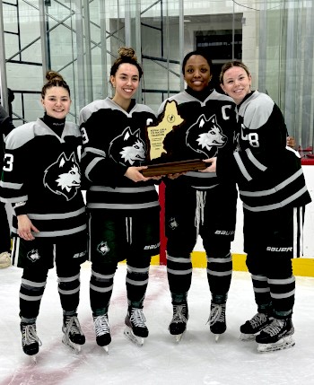 New Hampton (19-6-4) senior captains (L-R) Julia Loughlin, True Thompson, Kennedy Walker, and Kaleigh Michaud-Nolan are all smiles after a 4-1 win ove