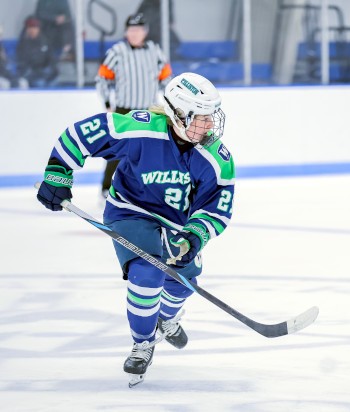 Williston junior forward Wiley Stoker keeps her eyes on the puck.