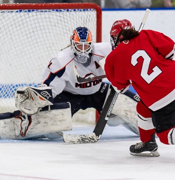 St. Paul's forward Natalie Tulchinsky blasts one by the Milton goaltender in their 5-1 victory Saturday at the Harrington.