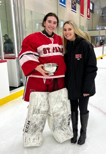 Ally Martiniello '24, St. Paul's goaltender and Large School MVP, with head coach Kelli Mackey.