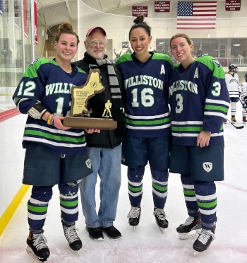 Williston captains Emily Crovo, Katherine Kang, and Ava DeCoste with Chuck Vernon.